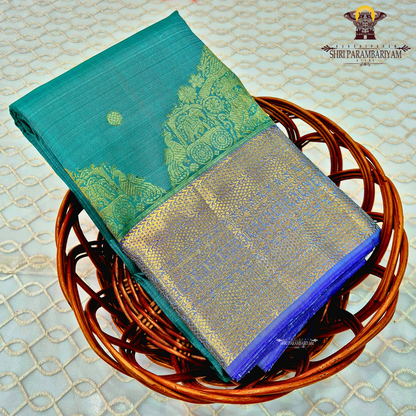 Elegant teal green (peacock green tone) body with a contrasting Saree