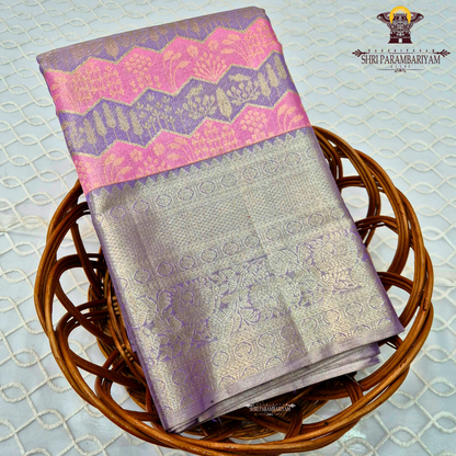 A graceful blend of lavender purple and soft silver tissue base Saree