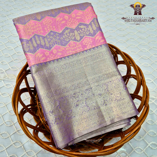 A graceful blend of lavender purple and soft silver tissue base Saree