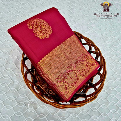 A deep rani pink (rich reddish-pink) Saree
