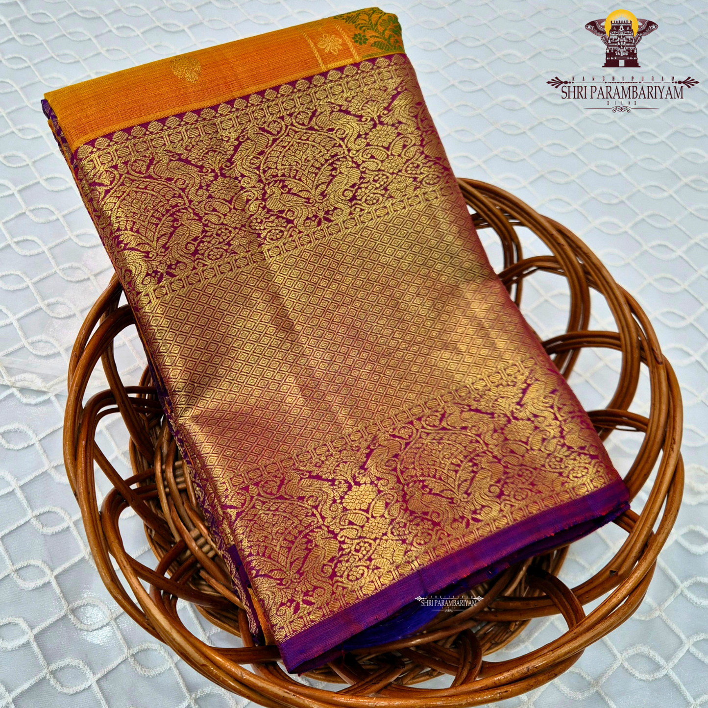 A mustard Yellow and Royal Purple with rich Gold Zari weaving Saree