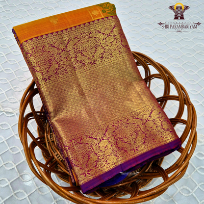 A mustard Yellow and Royal Purple with rich Gold Zari weaving Saree