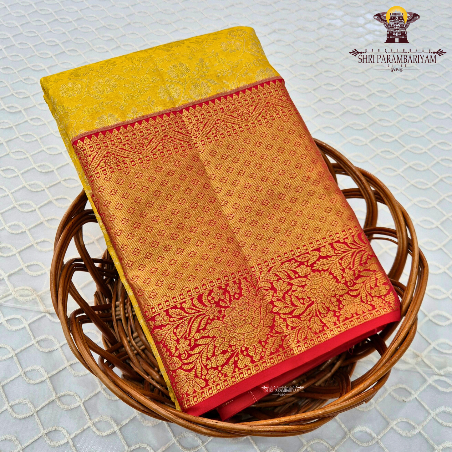 Vibrant sunshine yellow body paired with a rich red border Saree