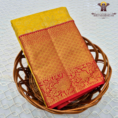 Vibrant sunshine yellow body paired with a rich red border Saree