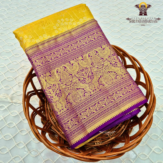 A vibrant sunshine yellow body paired with a rich royal purple border Saree