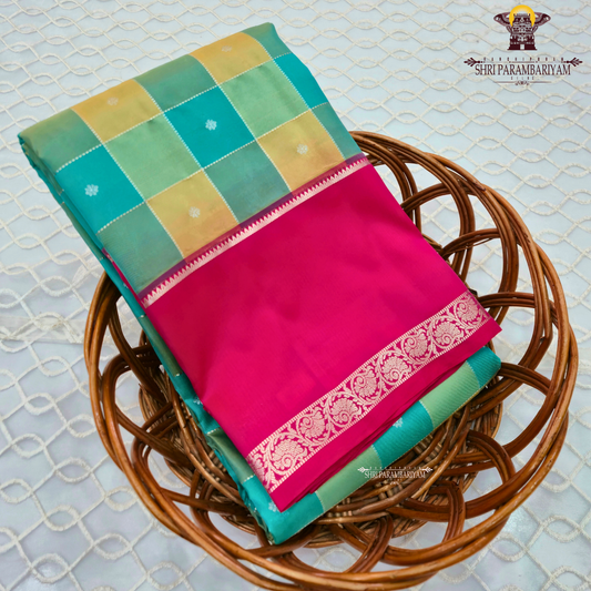Teal green with mustard-gold checked pattern Saree