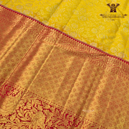 Vibrant sunshine yellow body paired with a rich red border Saree