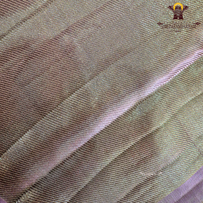 A beautiful champagne gold shade that gives a subtle and luxurious shimmer Saree