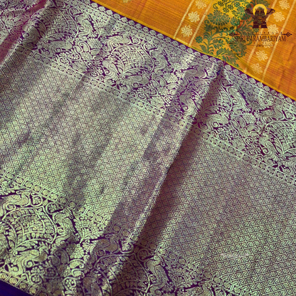 A mustard Yellow and Royal Purple with rich Gold Zari weaving Saree