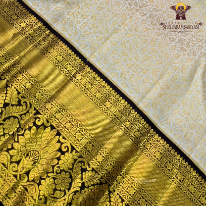 Elegant half white / off-white (ivory tone) with deep coffee brown contrast Saree