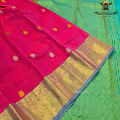 Vibrant rani pink / bright magenta body with gold zari buttas Saree