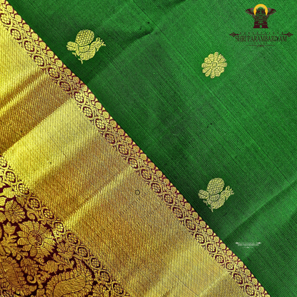 Elegant emerald green body with a rich gold zari Saree