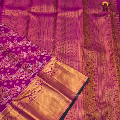 A rich magenta pink body with a contrasting dark green border Saree