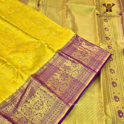 A vibrant sunshine yellow body paired with a rich royal purple border Saree