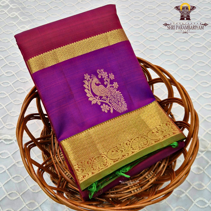 A elegant dual-tone royal purple with deep pink (rani/magenta) contrast Saree