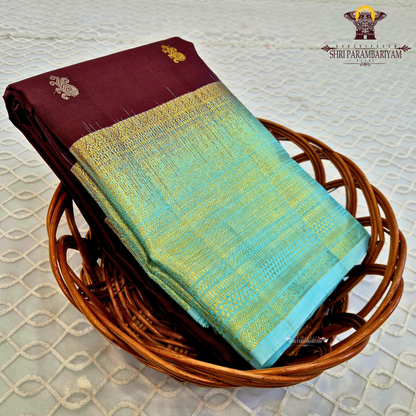 Rich Maroon body with a contrasting Aqua Blue Saree
