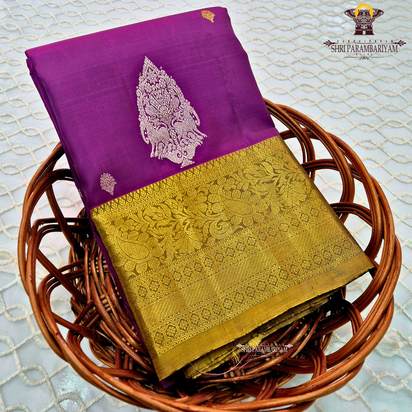 Rich royal purple (magenta-violet tone) with a contrasting antique gold zari border Saree
