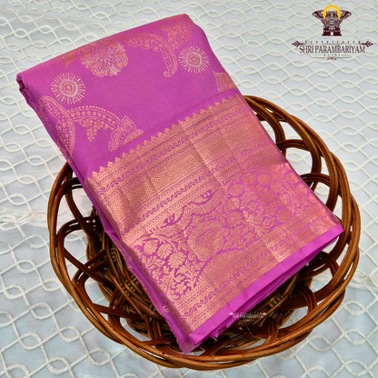 A bright and elegant rani pink (magenta tone) with rich gold zari Saree