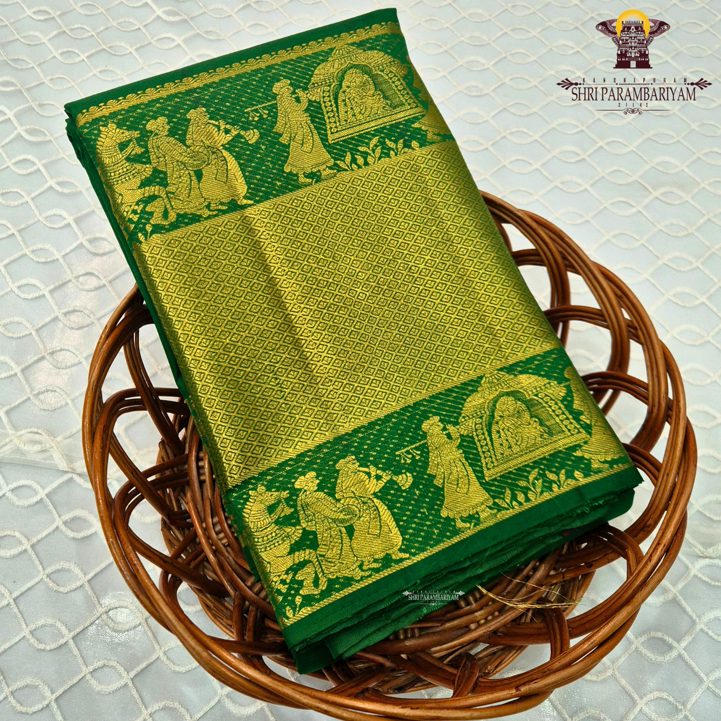 A rich Parrot Green with Antique Gold Zari Saree