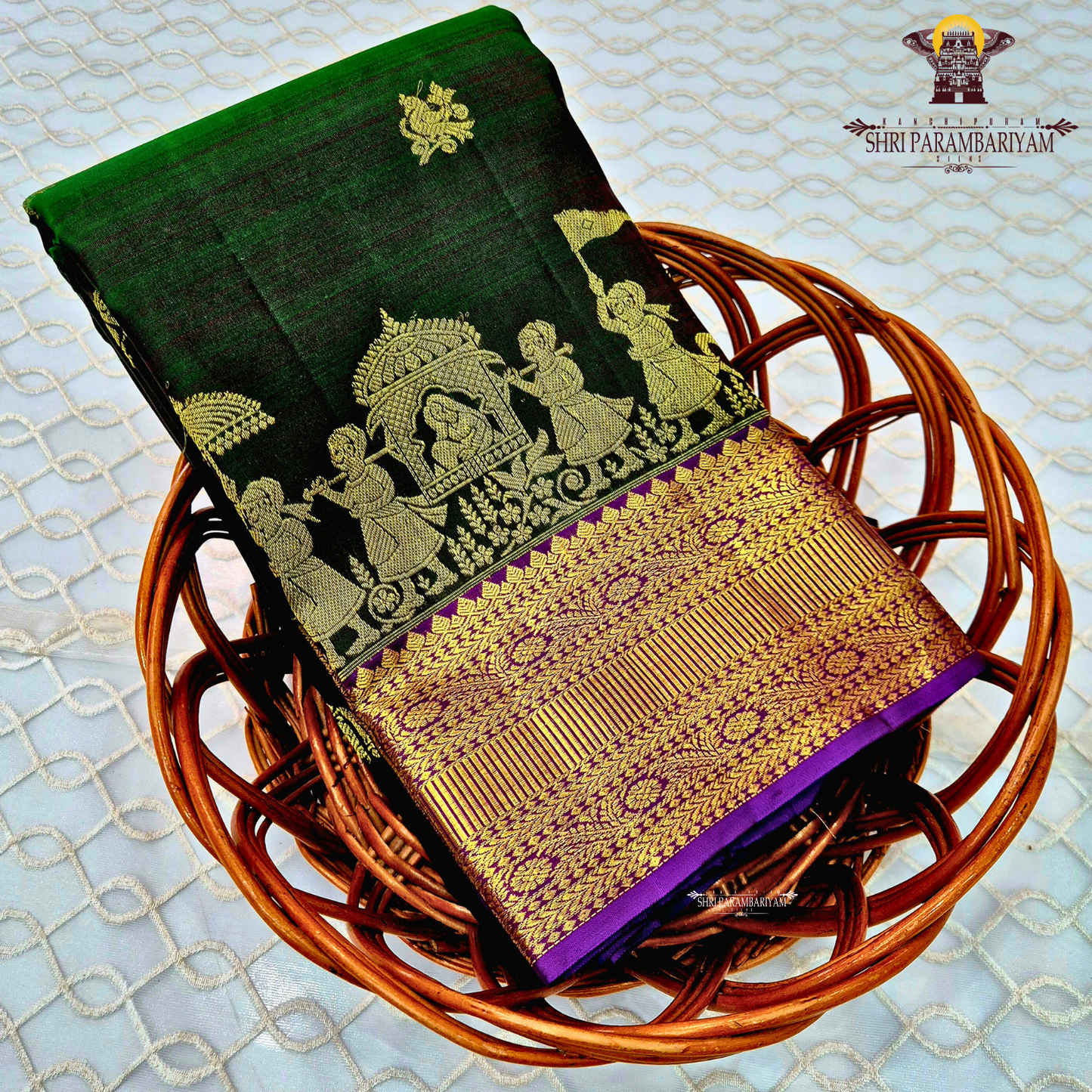 Deep bottle green body with a rich gold zari design Saree