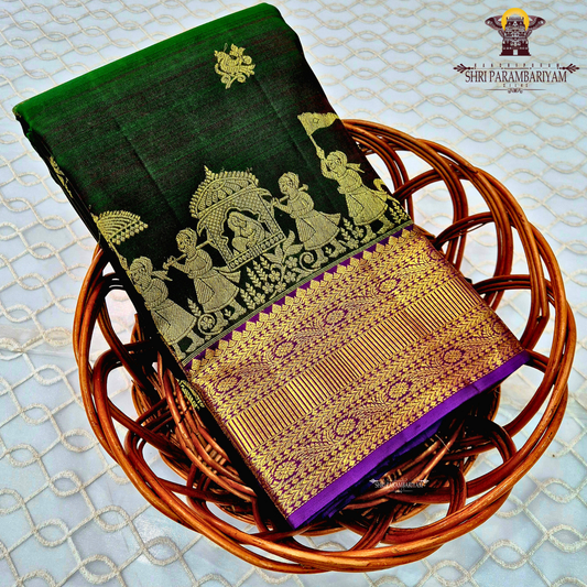 Deep bottle green body with a rich gold zari design Saree