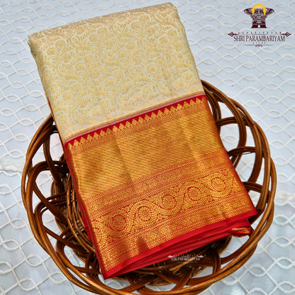 Elegant half white (off-white/ivory) body paired with a rich contrast red border Saree