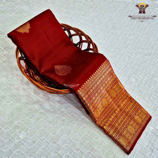 A rich Deep Maroon Red with exquisite gold zari weaving Saree