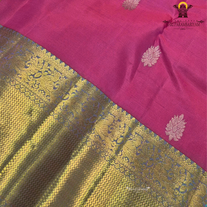 A vibrant rose pink body paired with a rich antique gold zari border Saree