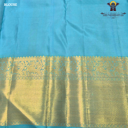 A vibrant rose pink body paired with a rich antique gold zari border Saree