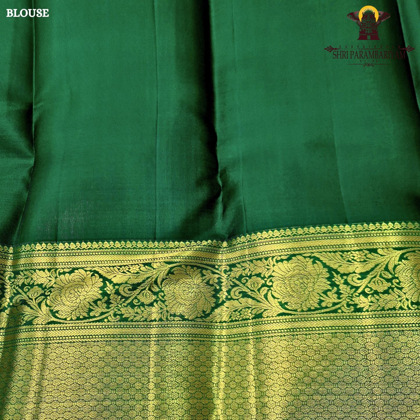 A rich magenta pink body with a contrasting dark green border Saree