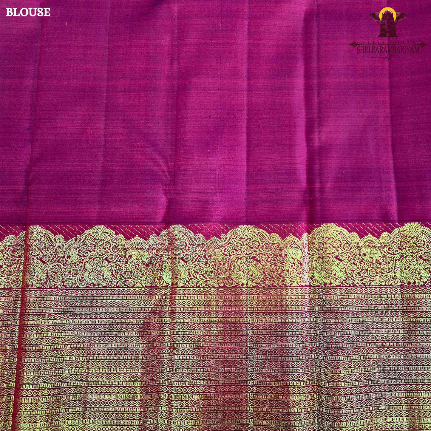 A vibrant ruby red body enhanced with delicate gold zari buttas Saree