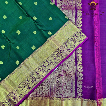 Elegant emerald green body with a rich gold zari Saree