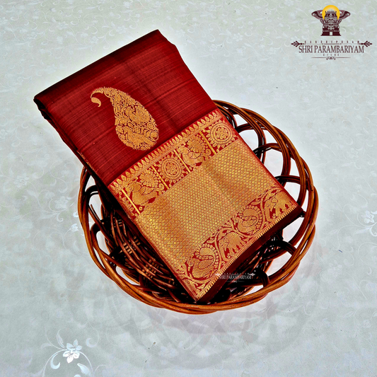 A rich maroon red Saree