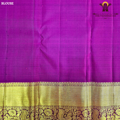 Elegant emerald green body with a rich gold zari Saree