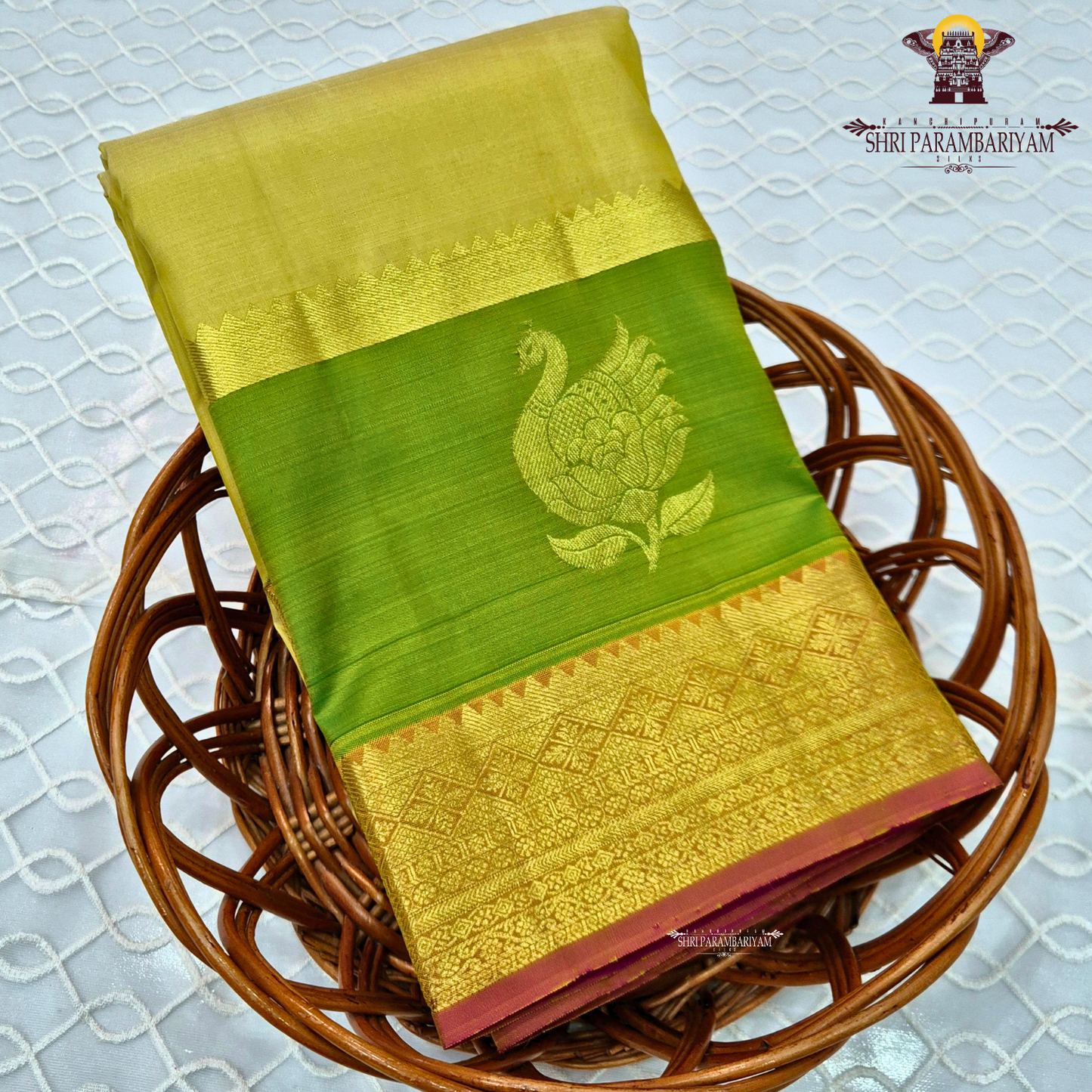 A pastel Yellow and Parrot Green with rich Gold Zari Saree