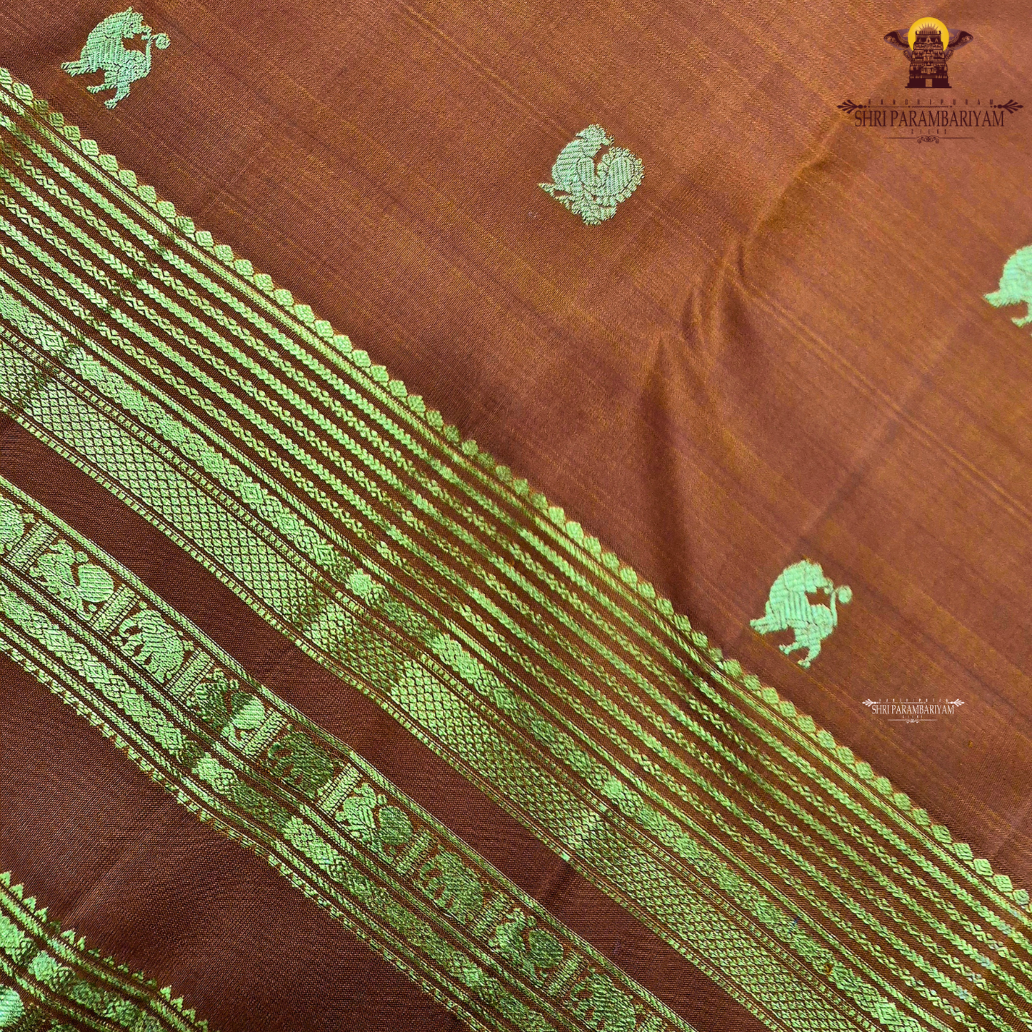 A rich Rust Orange / Burnt Copper Orange shade with an elegant golden zari Saree