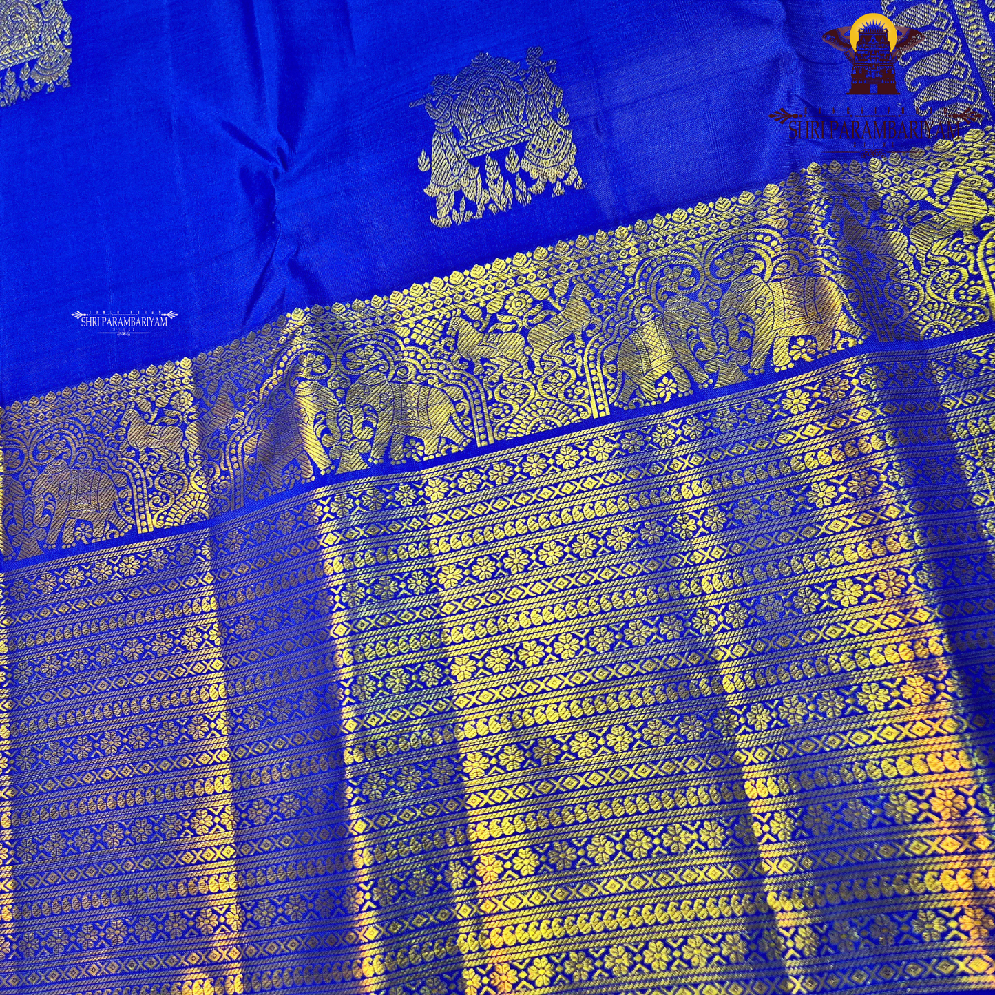 A vibrant Royal Blue with Antique Gold Zari Saree