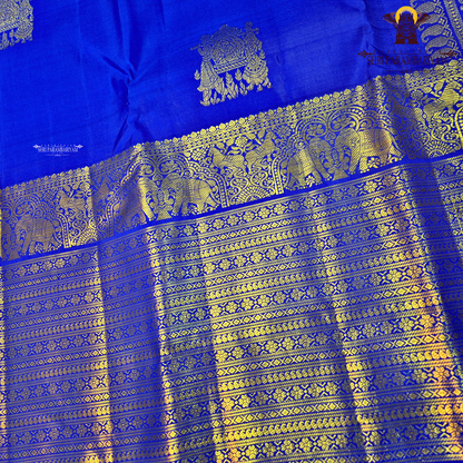 A vibrant Royal Blue with Antique Gold Zari Saree