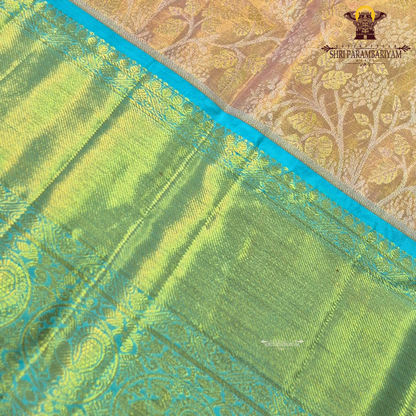 A soft peach / blush pink body paired with a contrasting aqua blue border Saree
