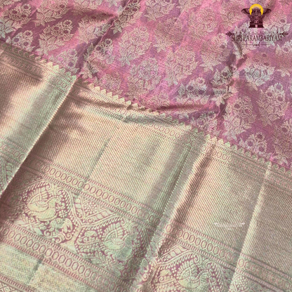 A charming soft baby pink shade beautifully blended with shimmering gold tissue Saree