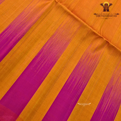 A striking dual-tone combination of vibrant rani pink and rich mustard orange Saree
