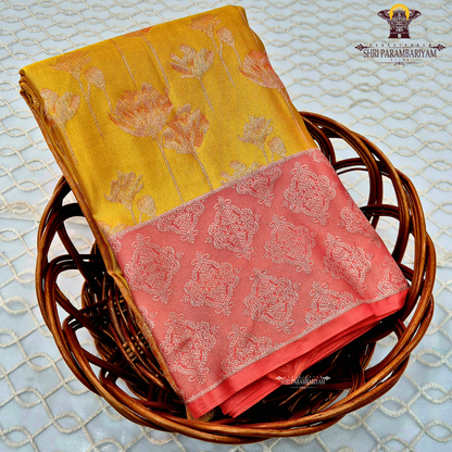 Mustard yellow body with coral pink / peach contrast pallu and elegant silver zari work Saree