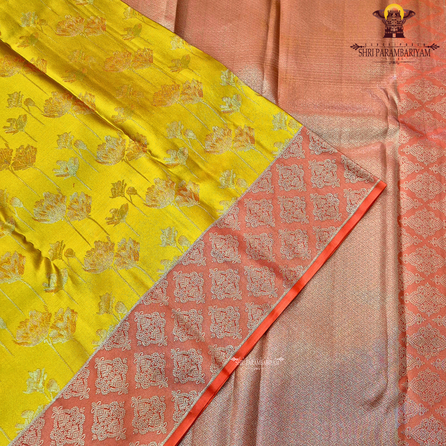 Mustard yellow body with coral pink / peach contrast pallu and elegant silver zari work Saree