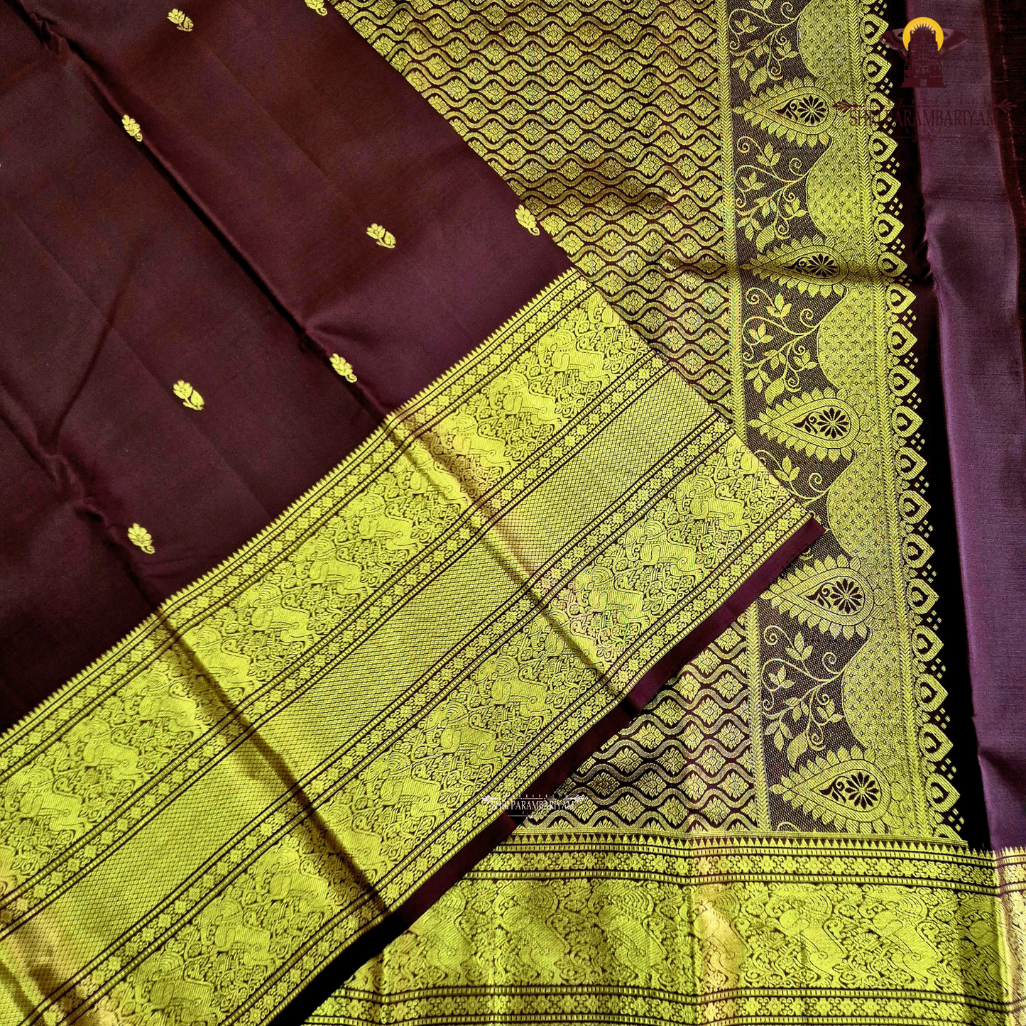 An elegant Deep Wine Maroon shade, beautifully enhanced with delicate gold zari Saree
