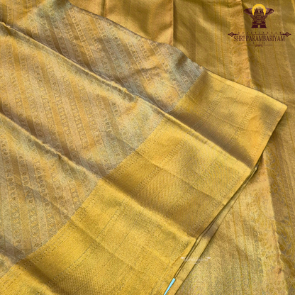 A rich bright golden shade that radiates a luxurious and traditional look Saree