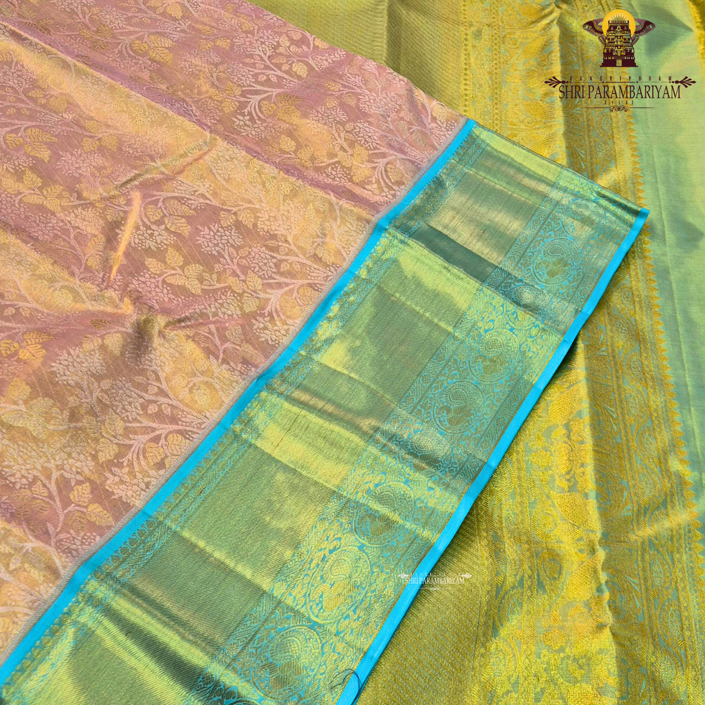 A soft peach / blush pink body paired with a contrasting aqua blue border Saree