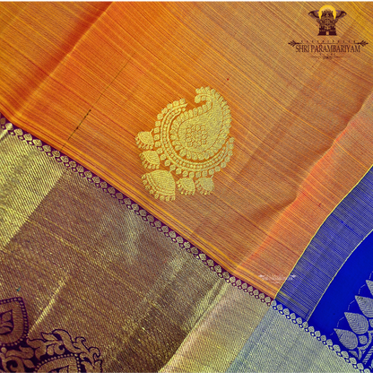 A rich Bright mango orange body with a rich gold zari Saree