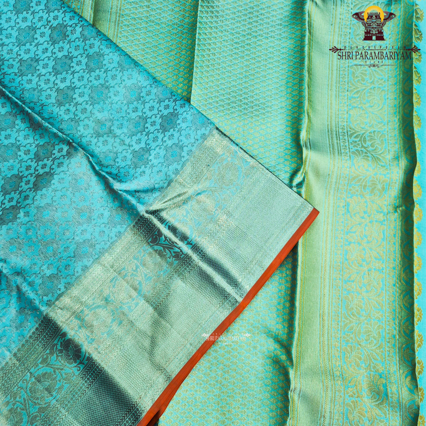 Elegant sea green / aqua blue shade with silver zari work and a subtle peach Saree