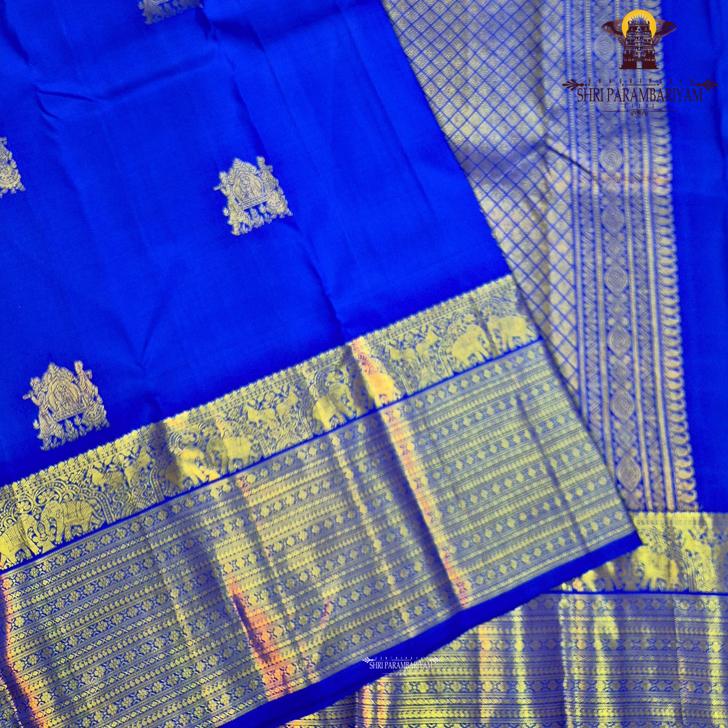 A vibrant Royal Blue with Antique Gold Zari Saree