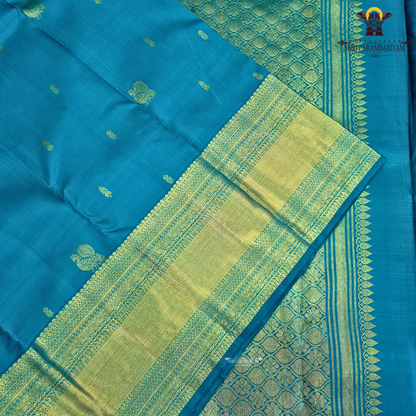 A elegant Peacock Blue (a vibrant blend of teal blue with a hint of turquoise) Saree